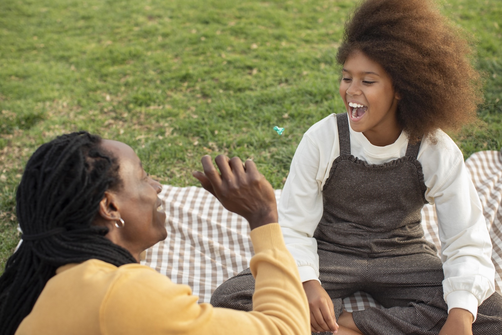 Care worker spending quality time with a child as part of home support services in Lusaka