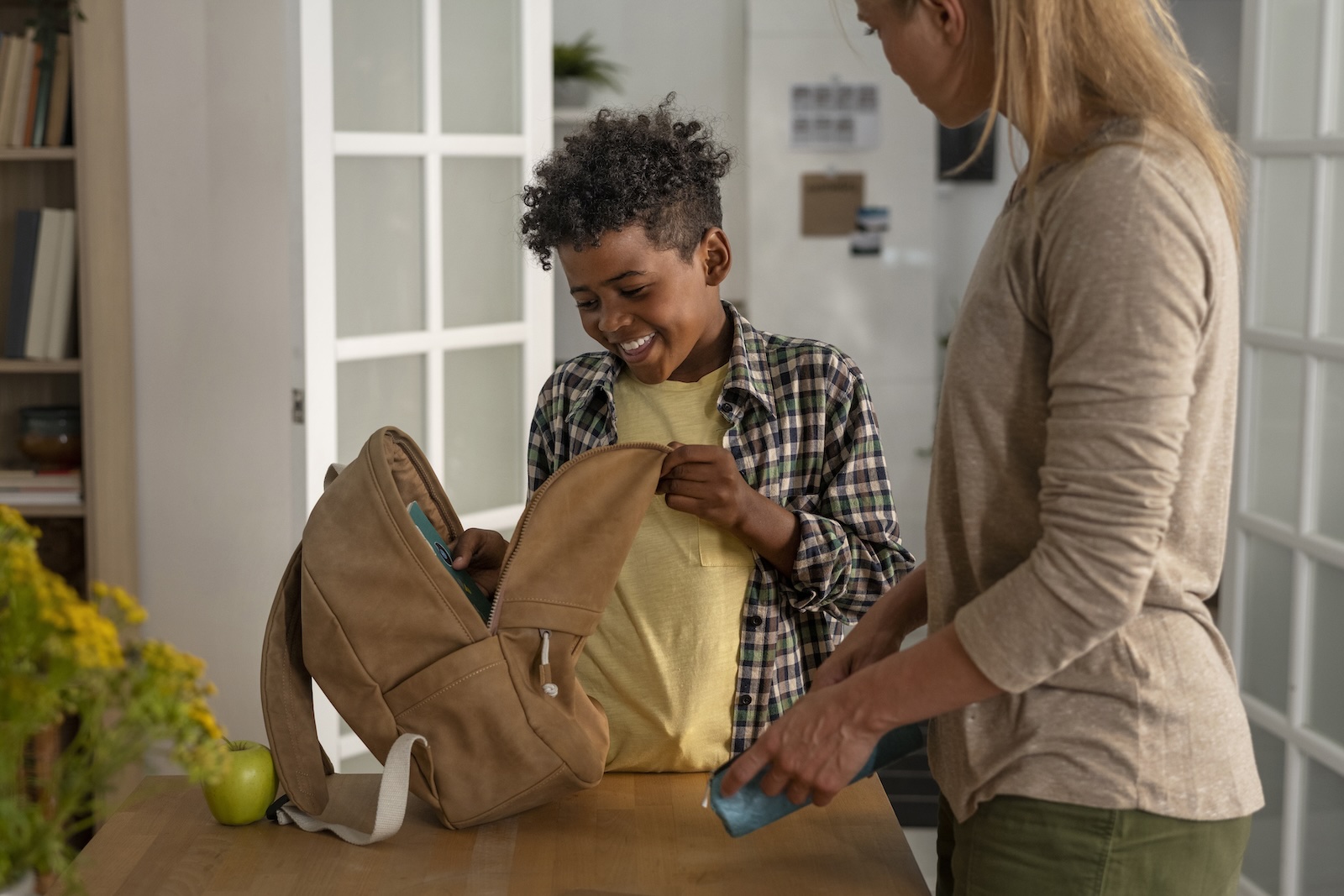 Parent preparing child for school with trusted school pick-up services in Lusaka